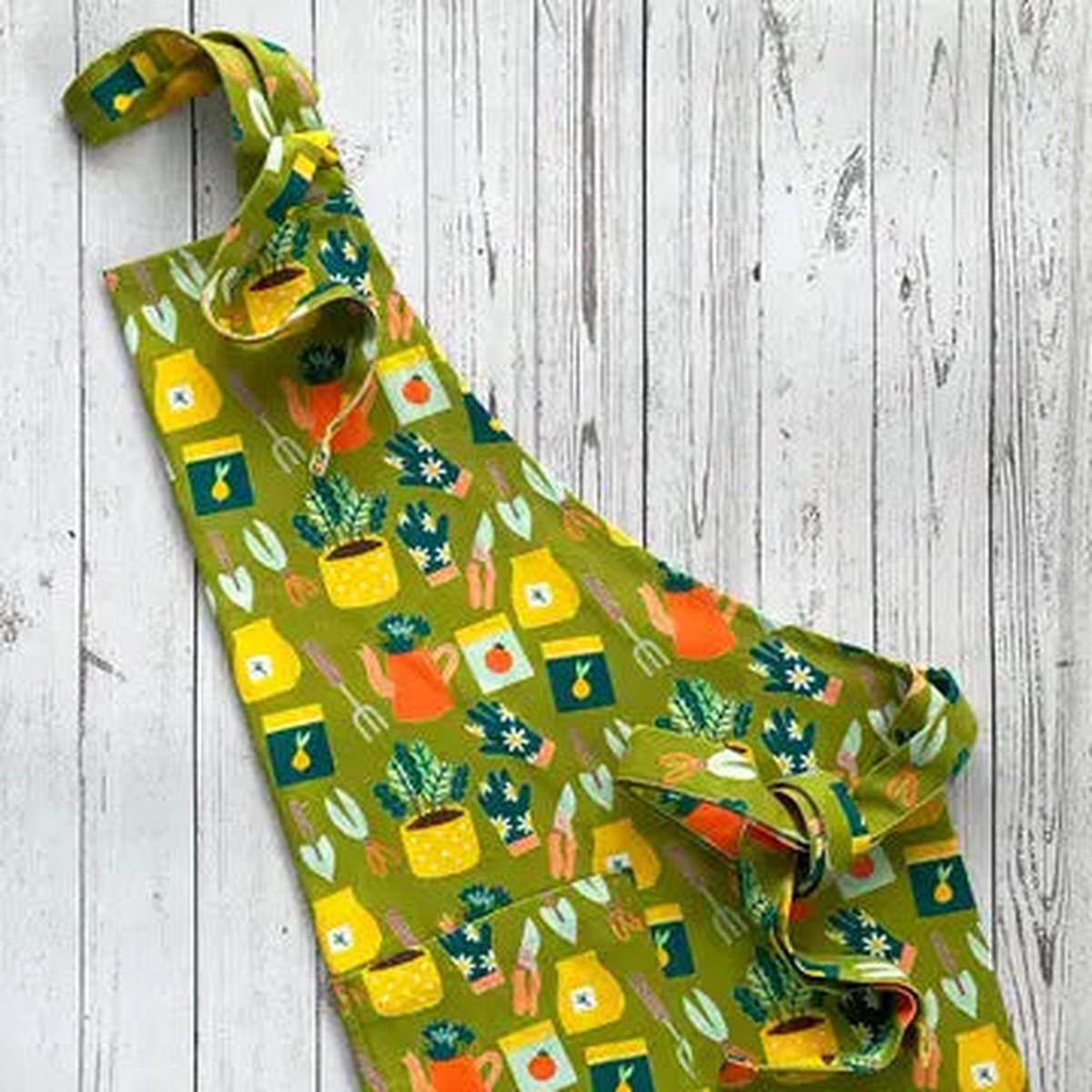Apron Planting A Garden